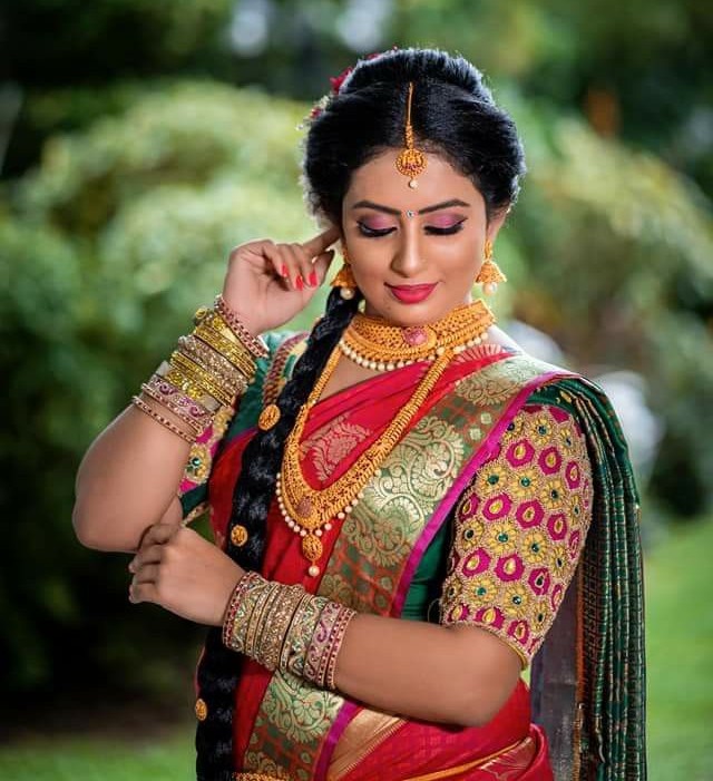 Artist of K & R Bridal Makeup Studio perfecting a bridal look